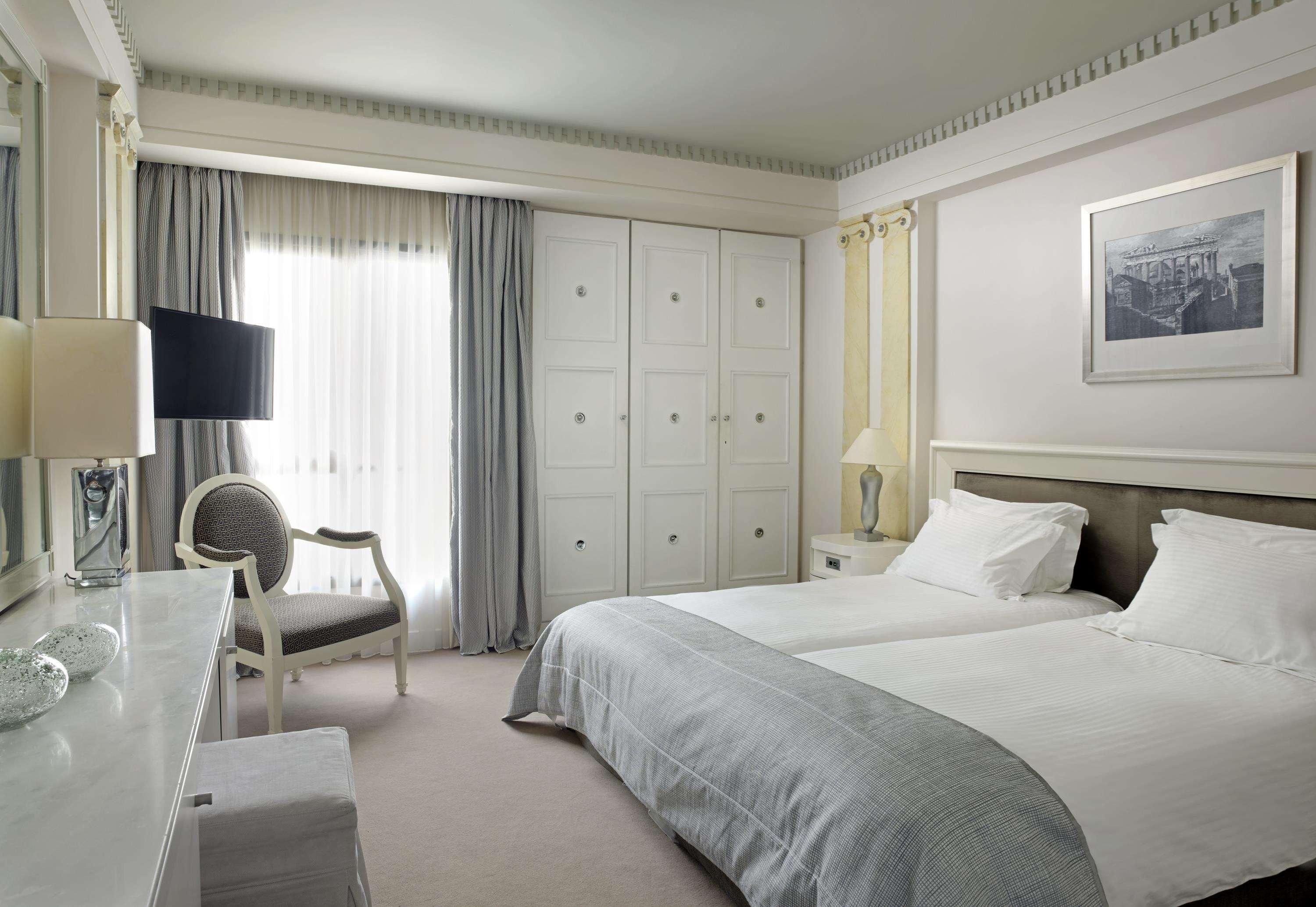 Njv Athens Plaza Hotel Ruang foto A room at the Hotel de la Paix
